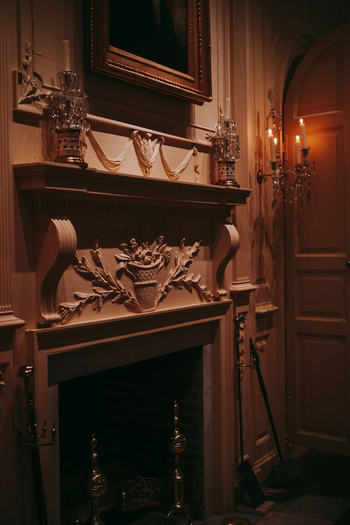 Carved limestone fireplace, candlelit