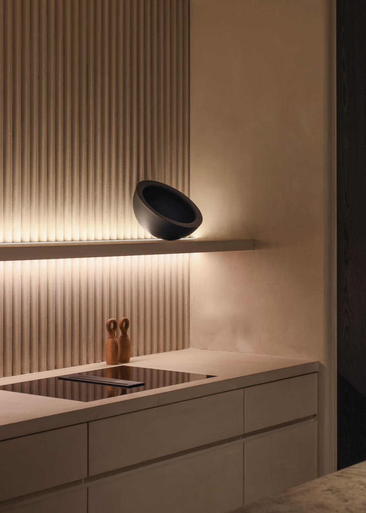 Cream-toned fitted kitchen and joinery wall