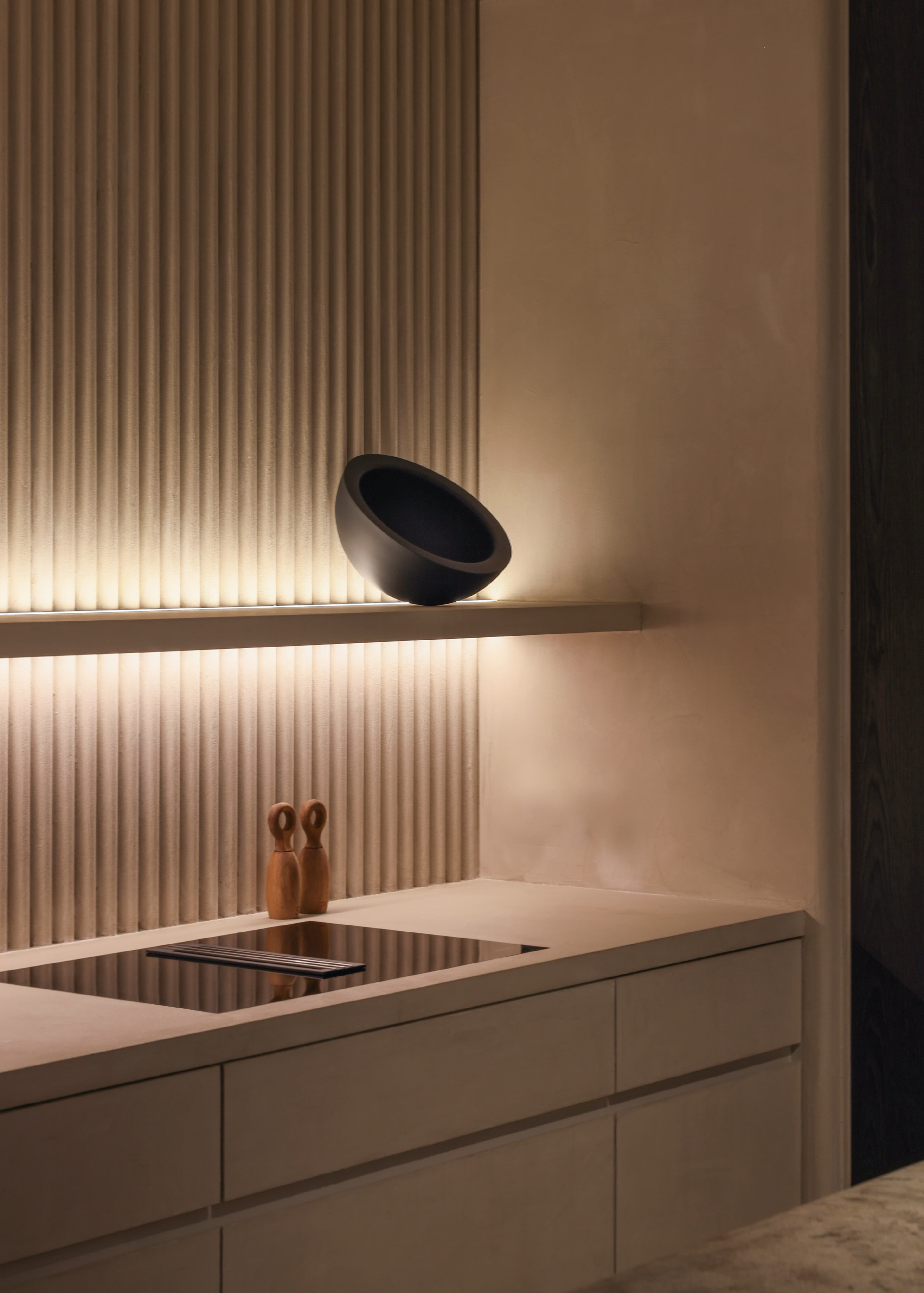 Cream-toned fitted kitchen and joinery wall