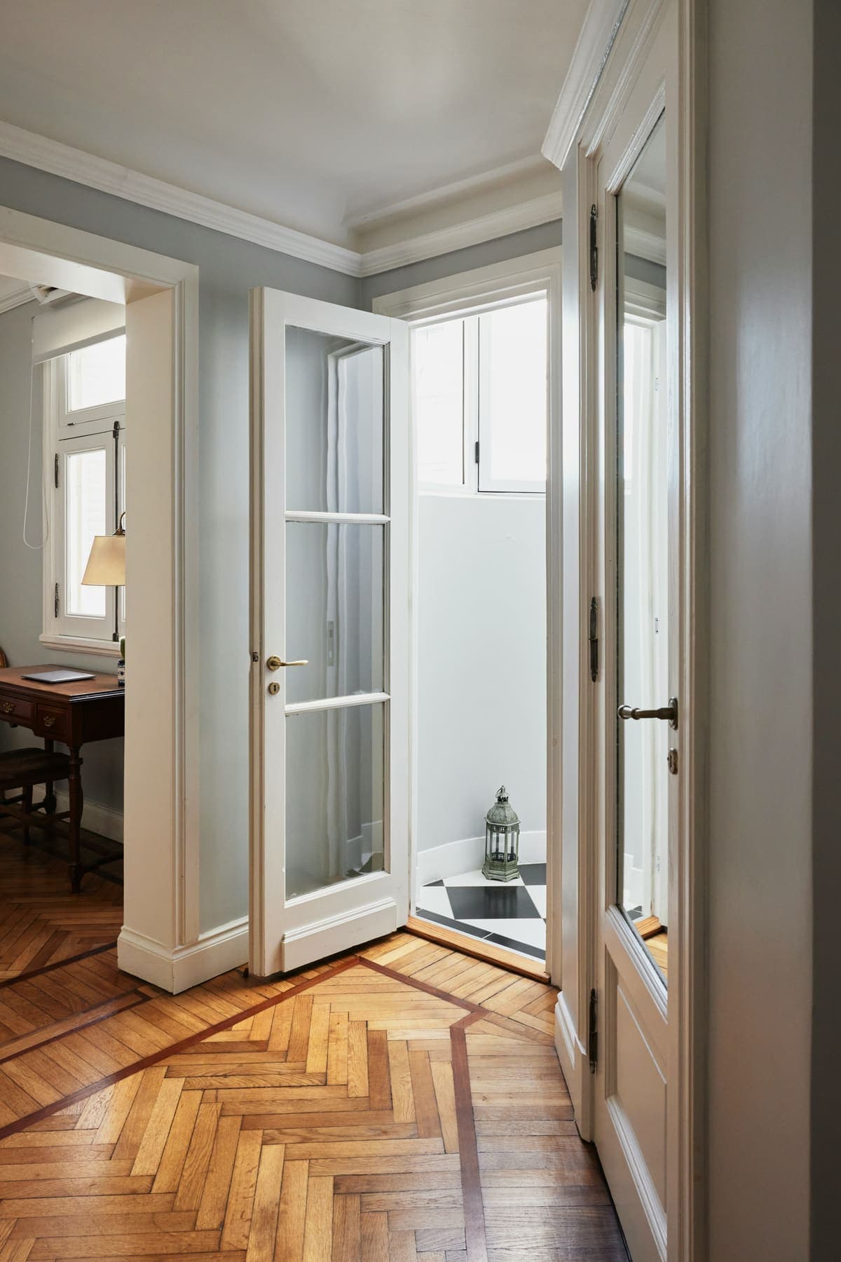 Period doorway opening to herringbone floor