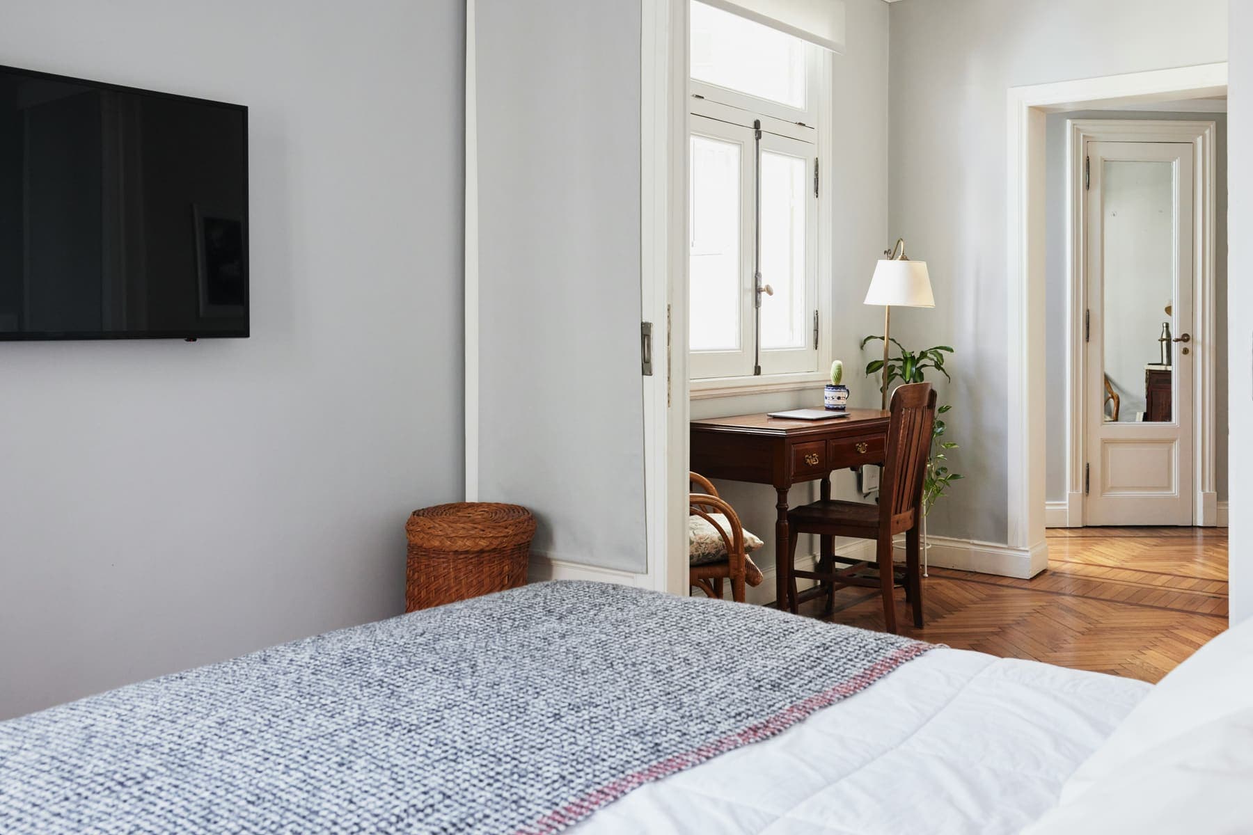 Bedroom with antique writing desk through doorway